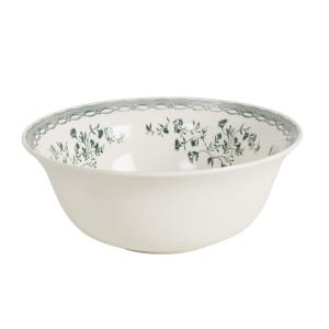 Ensaladera de cerámica blanca y flores verdes