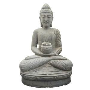 Estatua de buda de piedra volcánica en posición de ofrenda…