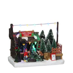 Miniatura de la aldea de navidad puesto de árboles de navid…