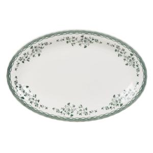 Plato de presentación de cerámica blanca con flores verdes