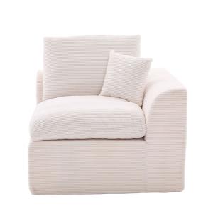 Sillón de tela de pana beige con cojín