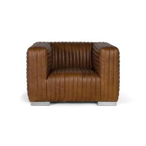 Sillón tapizado en cuero forma cúbica y patas de acero