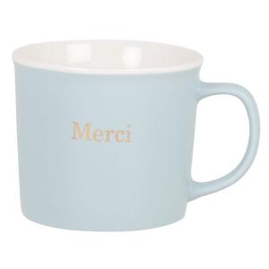 Taza de porcelana azul y blanca con inscripción dorada