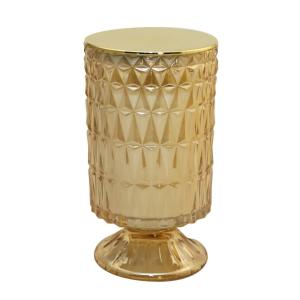 Vela dorada sobre pie con fragancia de flor de algodón. h18…