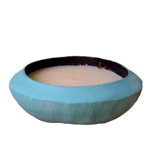 Vela perfumada en cáscara de coco, color turquesa