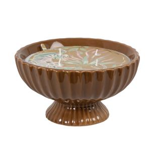 Vela perfumada en cuenco en tarro de cerámica amarillo ocre