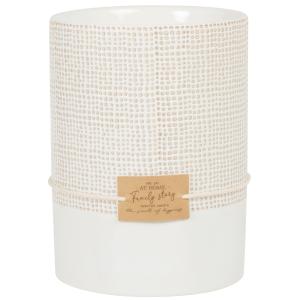 Vela perfumada en tarro de cerámica blanca y color caramelo…